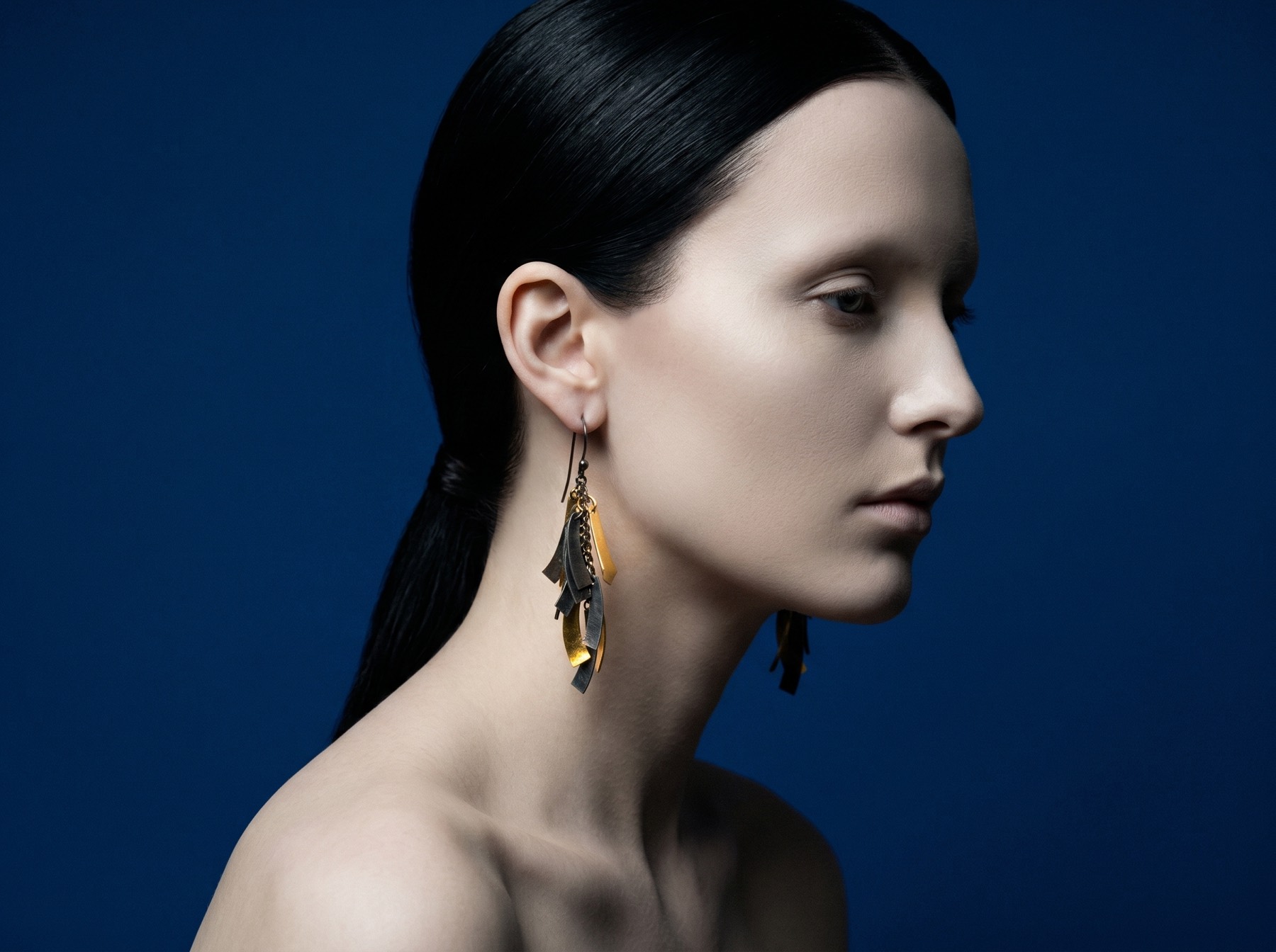 Blue-ground profile portrait with earring.